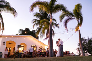 first dance island sunset twinkle lights